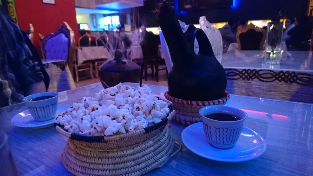 Etiopean coffee served with popcorn at Horn of Africa.