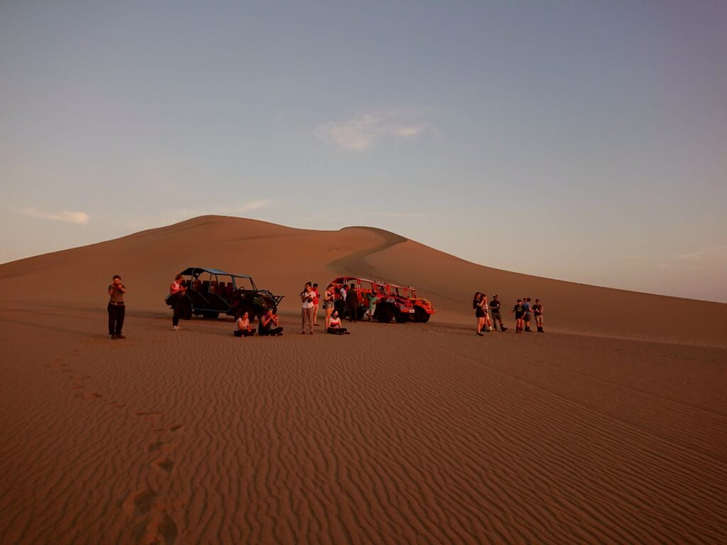 After racing around the dunes and setting a large climate footprint, it was time to watch the sunset. The tourist route, Huacachina, Peru.